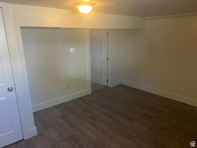 3071 Quincy Ave, Ogden, UT 84403 - unfurnished room with dark wood-style floors and baseboards