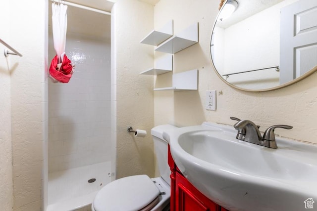 3071 Quincy Ave, Ogden, UT 84403 - bathroom featuring a textured wall, a stall shower, and vanity