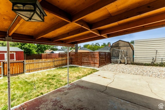 3071 Quincy Ave, Ogden, UT 84403 - fenced backyard featuring a storage shed and a patio area