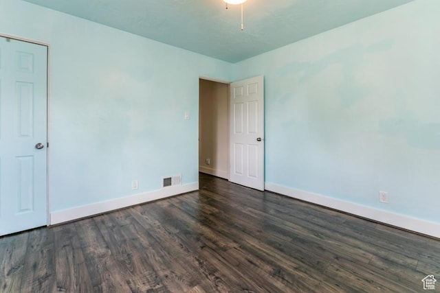 3071 Quincy Ave, Ogden, UT 84403 - unfurnished room featuring baseboards and dark wood-style floors