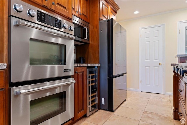 5791 S Oakwood Dr W, South Ogden, UT 84405 - kitchen featuring stainless steel appliances, ornamental molding, light tile patterned flooring, brown cabinets, and wine cooler