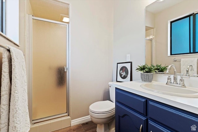 5791 S Oakwood Dr W, South Ogden, UT 84405 - bathroom with a shower stall, vanity, and wood finished floors
