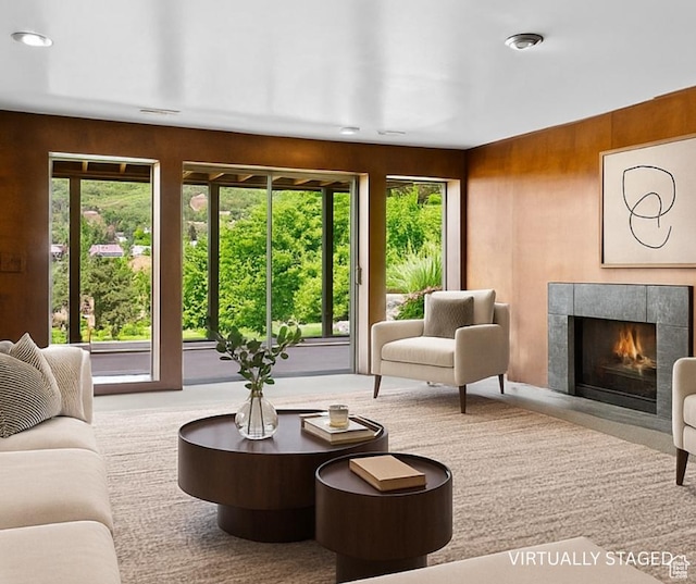 3683 E Cove Point Dr, Millcreek, UT 84109 - living room featuring a tile fireplace, recessed lighting, and wooden walls