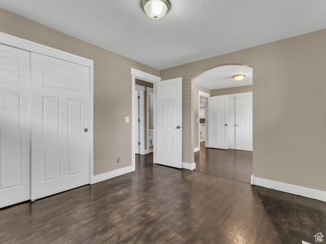 787 E Casa Blanco Cir, Midvale, UT 84047 - unfurnished bedroom with arched walkways and wood finished floors