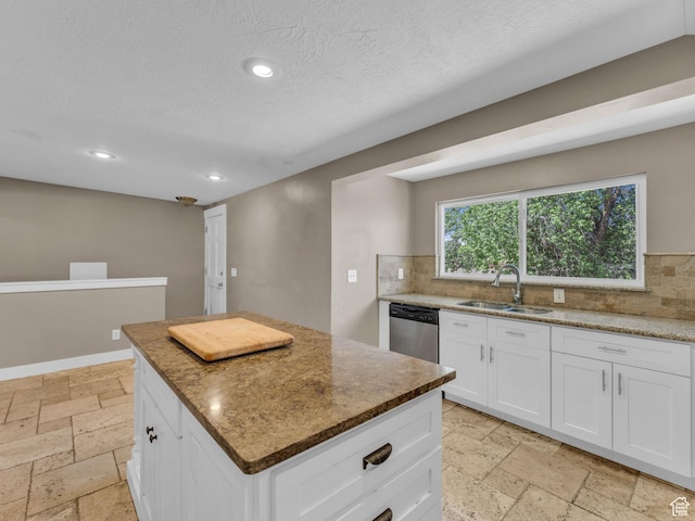 787 E Casa Blanco Cir, Midvale, UT 84047 - kitchen featuring dishwasher, stone tile floors, backsplash, recessed lighting, and light stone counters