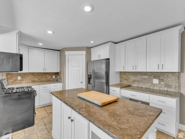 787 E Casa Blanco Cir, Midvale, UT 84047 - kitchen featuring stainless steel fridge with ice dispenser, a kitchen island, range with gas cooktop, tasteful backsplash, and recessed lighting