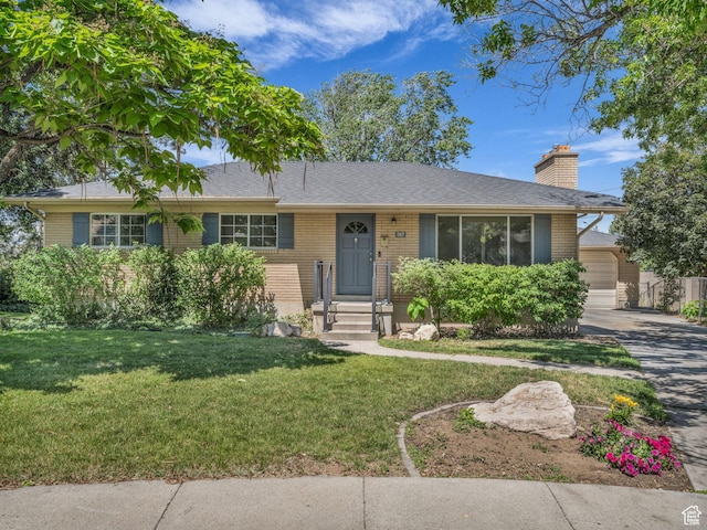 787 E Casa Blanco Cir, Midvale, UT 84047 - single story home with a chimney, a front lawn, brick siding, and a garage