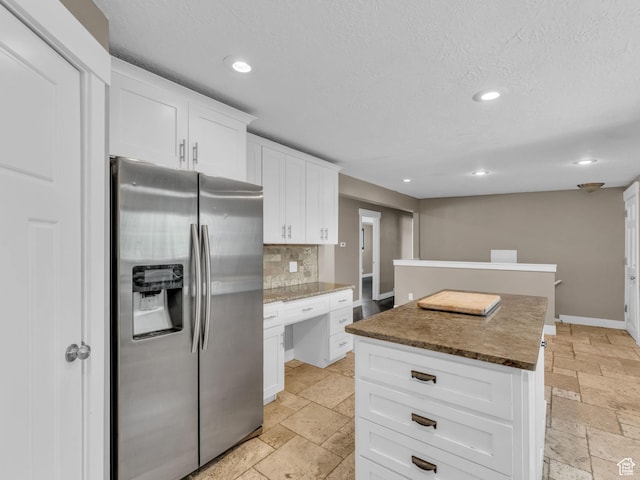 787 E Casa Blanco Cir, Midvale, UT 84047 - kitchen with stainless steel refrigerator with ice dispenser, stone tile flooring, recessed lighting, a kitchen island, and decorative backsplash