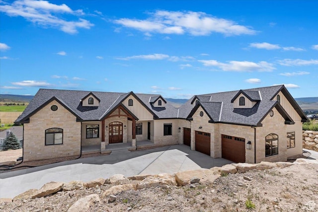 1023 W Lime Canyon Rd, Midway, UT 84049 - french country home with board and batten siding, stone siding, driveway, and a shingled roof