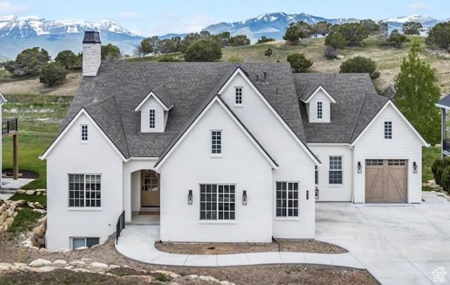 1023 W Lime Canyon Rd, Midway, UT 84049 - view of front of home featuring a mountain view, driveway, roof with shingles, and a chimney