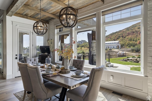 1023 W Lime Canyon Rd, Midway, UT 84049 - sunroom / solarium featuring a chandelier, plenty of natural light, and beam ceiling