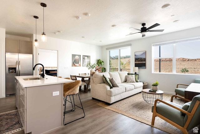 875 W Akoya Pearl St Unit 205, St George, UT 84790 - living area featuring a ceiling fan and dark wood-style flooring