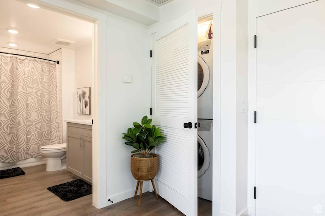875 W Akoya Pearl St Unit 205, St George, UT 84790 - washroom with stacked washer and clothes dryer and wood finished floors