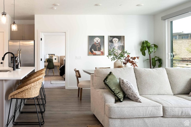 875 W Akoya Pearl St Unit 205, St George, UT 84790 - living area featuring dark wood-style floors and baseboards