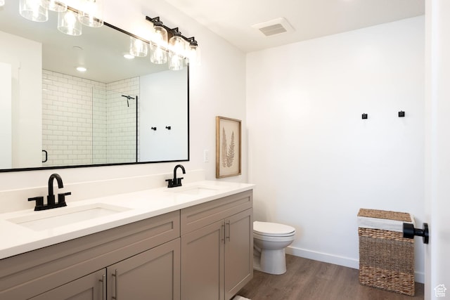 875 W Akoya Pearl St Unit 205, St George, UT 84790 - full bath featuring double vanity, wood finished floors, and a tile shower