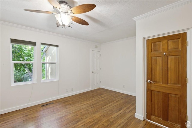 537 N Darwin St W, Salt Lake City, UT 84103 - empty room with wood finished floors, ornamental molding, ceiling fan, and a textured ceiling