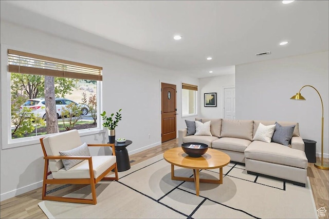 537 N Darwin St W, Salt Lake City, UT 84103 - living room with healthy amount of natural light, recessed lighting, and light wood-type flooring