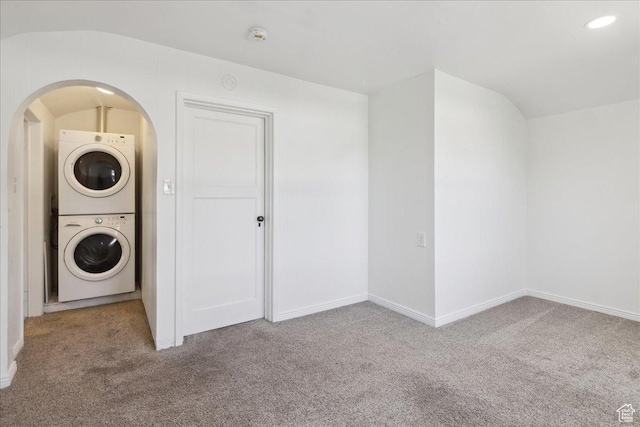 537 N Darwin St W, Salt Lake City, UT 84103 - washroom with stacked washer / dryer, carpet, and arched walkways
