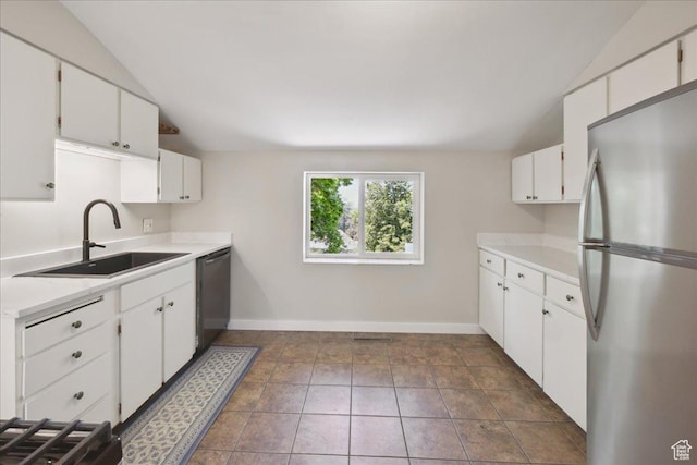537 N Darwin St W, Salt Lake City, UT 84103 - kitchen featuring appliances with stainless steel finishes, lofted ceiling, light countertops, and white cabinetry