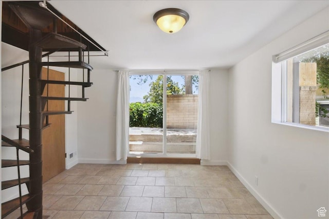 537 N Darwin St W, Salt Lake City, UT 84103 - spare room with stairs and light tile patterned flooring