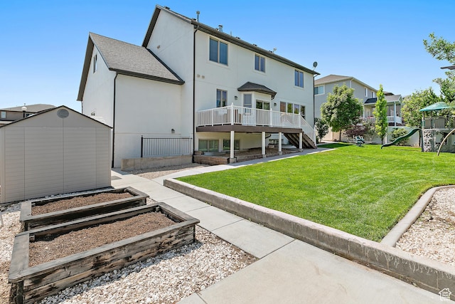 1471 S Sage Bloom Way, Saratoga Springs, UT 84045 - rear view of house featuring a shed, a lawn, stairs, a deck, and stucco siding
