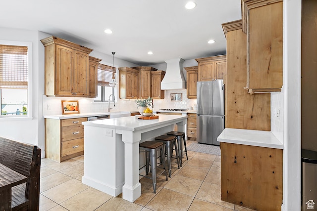1471 S Sage Bloom Way, Saratoga Springs, UT 84045 - kitchen featuring stainless steel appliances, premium range hood, a center island, tasteful backsplash, and a breakfast bar area