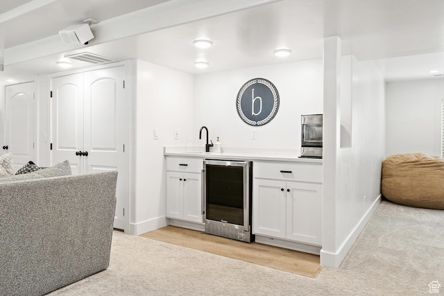 1471 S Sage Bloom Way, Saratoga Springs, UT 84045 - indoor wet bar with beverage cooler, light carpet, and light wood-style flooring