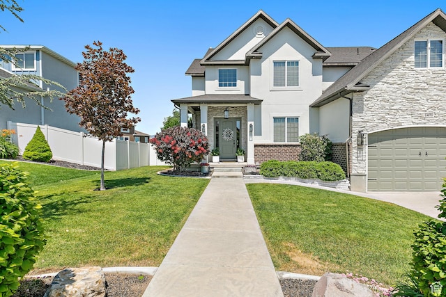 1471 S Sage Bloom Way, Saratoga Springs, UT 84045 - traditional-style home featuring stone siding, stucco siding, a garage, and concrete driveway