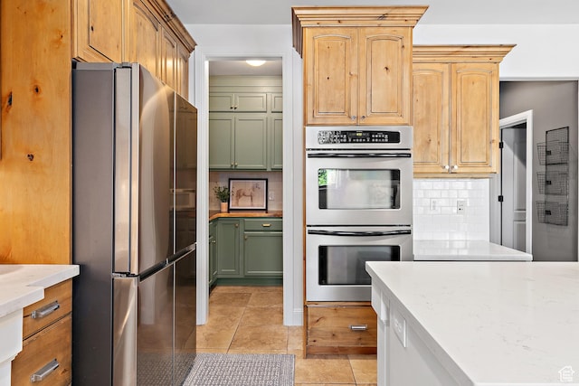 1471 S Sage Bloom Way, Saratoga Springs, UT 84045 - kitchen with appliances with stainless steel finishes, backsplash, light tile patterned floors, and light stone counters