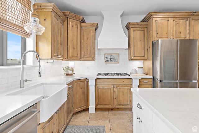 1471 S Sage Bloom Way, Saratoga Springs, UT 84045 - kitchen featuring appliances with stainless steel finishes, wall chimney exhaust hood, light countertops, tasteful backsplash, and light tile patterned flooring