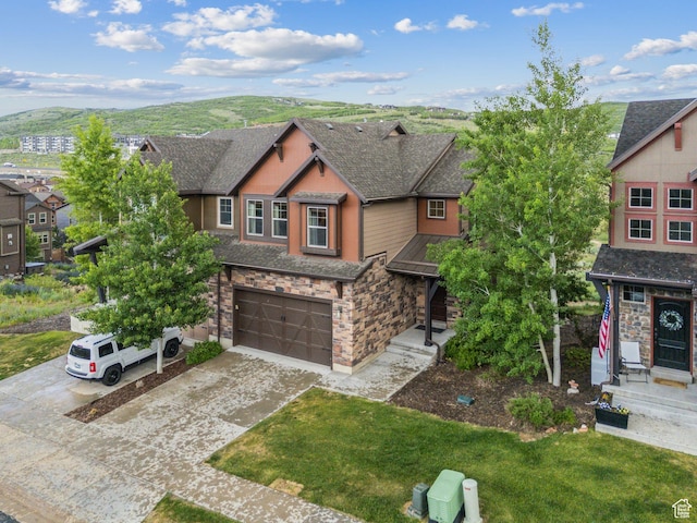 1046 W Abigail Dr, Heber City, UT 84032 - craftsman inspired home featuring stone siding, a garage, concrete driveway, roof with shingles, and a mountain view