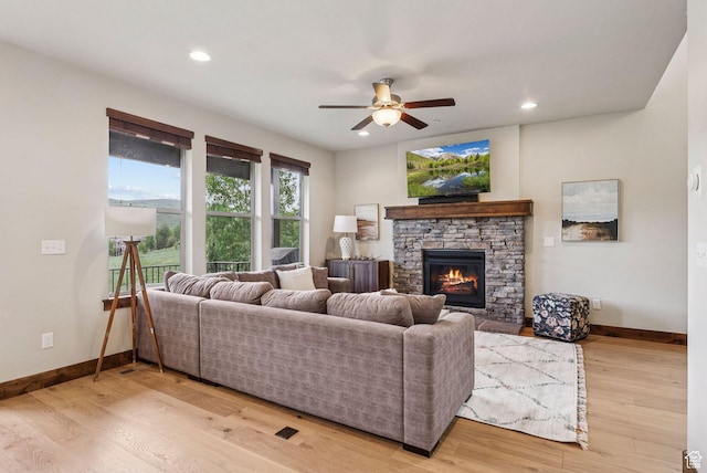 1046 W Abigail Dr, Heber City, UT 84032 - living room featuring ceiling fan, a stone fireplace, light wood-style floors, and recessed lighting