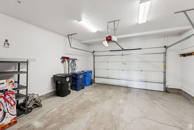 1046 W Abigail Dr, Heber City, UT 84032 - garage featuring a garage door opener and baseboards