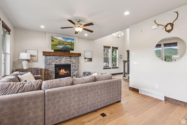 1046 W Abigail Dr, Heber City, UT 84032 - living area with ceiling fan, recessed lighting, light wood finished floors, a stone fireplace, and healthy amount of natural light