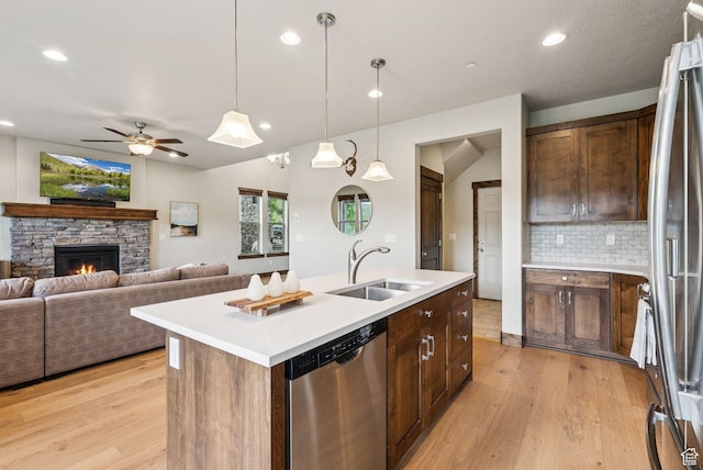 1046 W Abigail Dr, Heber City, UT 84032 - kitchen with appliances with stainless steel finishes, light wood finished floors, tasteful backsplash, light countertops, and recessed lighting