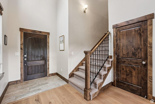 1046 W Abigail Dr, Heber City, UT 84032 - entrance foyer featuring wood finished floors, stairway, and a high ceiling