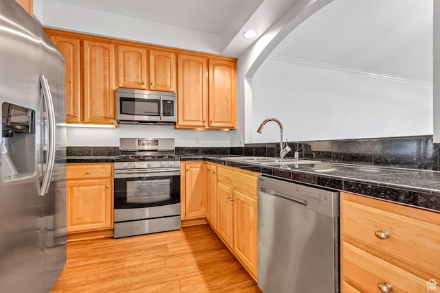 5005 N Edgewood Dr W Unit 301, Provo, UT 84604 - kitchen featuring appliances with stainless steel finishes, tile counters, light wood finished floors, arched walkways, and recessed lighting