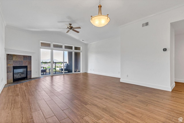 5005 N Edgewood Dr W Unit 301, Provo, UT 84604 - unfurnished living room with a ceiling fan, light wood-style flooring, lofted ceiling, ornamental molding, and a tile fireplace