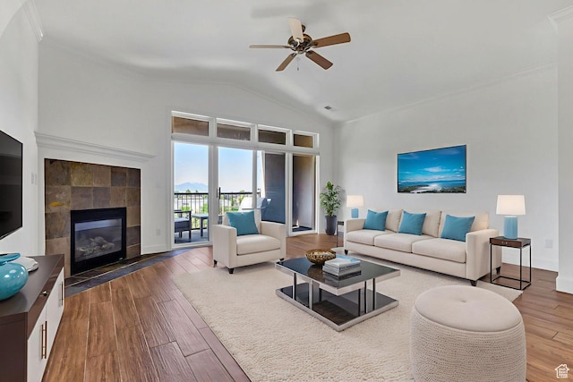 5005 N Edgewood Dr W Unit 301, Provo, UT 84604 - living area featuring wood finished floors, a ceiling fan, vaulted ceiling, a tile fireplace, and crown molding