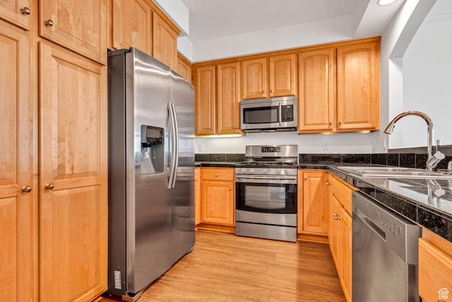 5005 N Edgewood Dr W Unit 301, Provo, UT 84604 - kitchen with stainless steel appliances, tile counters, and light wood-type flooring