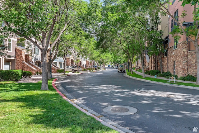 5005 N Edgewood Dr W Unit 301, Provo, UT 84604 - view of asphalt road featuring curbs and sidewalks