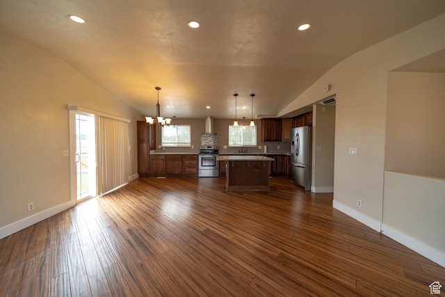 685 W 2550 S, Price, UT 84501 - kitchen with appliances with stainless steel finishes, lofted ceiling, a chandelier, dark wood-style floors, and a center island