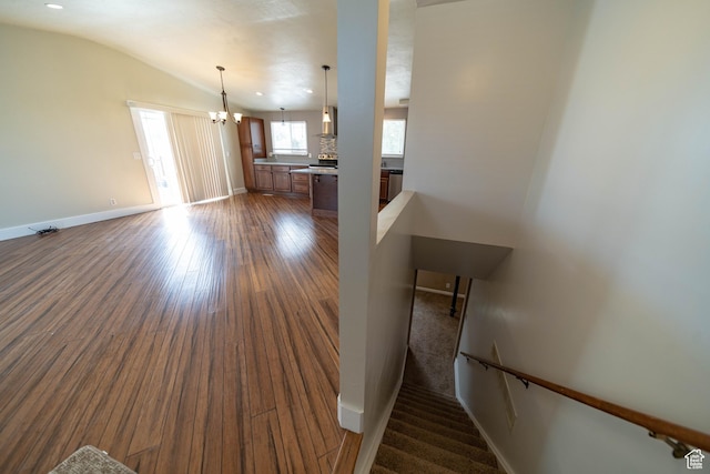 685 W 2550 S, Price, UT 84501 - unfurnished living room featuring dark wood-style flooring, a chandelier, and vaulted ceiling