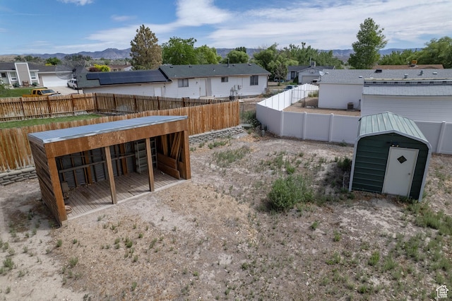 685 W 2550 S, Price, UT 84501 - view of yard featuring an outdoor structure, a residential view, a mountain view, and an exterior structure