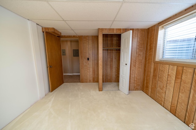 685 W 2550 S, Price, UT 84501 - unfurnished bedroom with wooden walls, carpet floors, a drop ceiling, and a closet