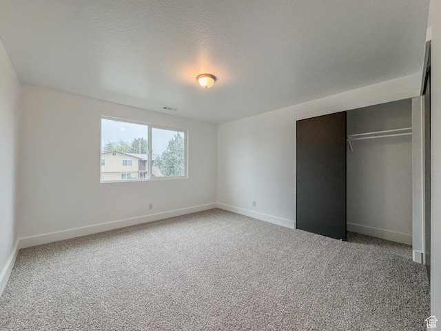 1464 S 50 E, Orem, UT 84058 - unfurnished bedroom featuring carpet, a closet, and a textured ceiling