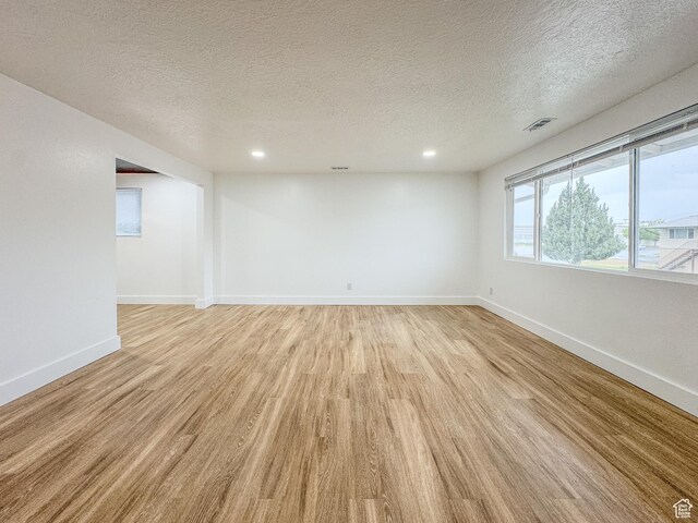 1464 S 50 E, Orem, UT 84058 - spare room with light wood finished floors, a textured ceiling, and recessed lighting