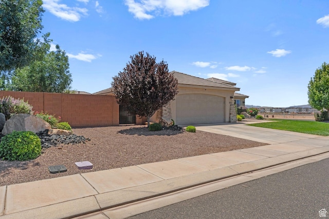 902 E 3950 S, Washington, UT 84780 - view of front of property featuring an attached garage, concrete driveway, stucco siding, and a tile roof