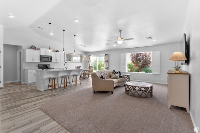 902 E 3950 S, Washington, UT 84780 - living room featuring ceiling fan, light wood finished floors, vaulted ceiling, and recessed lighting