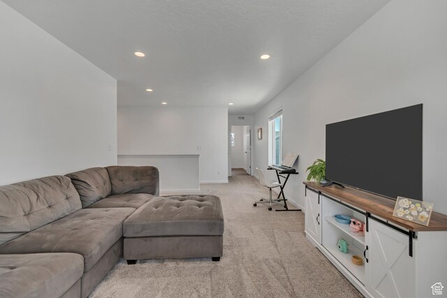 5451 N Yeager Ln, Eagle Mountain, UT 84005 - living room with recessed lighting and light colored carpet
